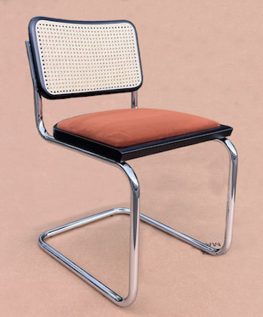 Marcel Breuer - Cesca Chair with padded seat and exsposed frame.